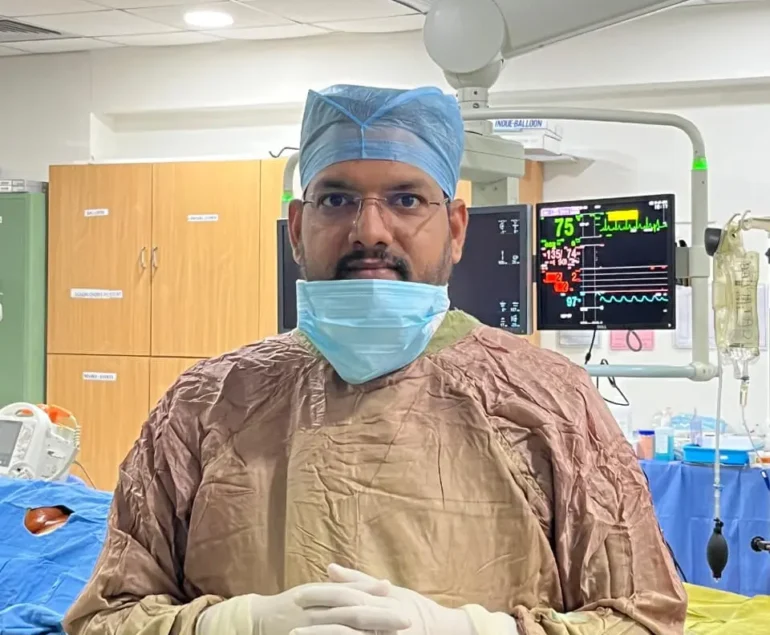 Interventional Radiologist Dr. Rakesh Kumawat performing varicocele embolization treatment in Jaipur inside a modern cath lab in Rajasthan.